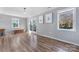 Cozy living room showcasing natural light, neutral walls, and wood-look flooring at 1628 Shannonhouse Dr, Charlotte, NC 28215