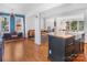 Open floor plan showcasing the kitchen, living, and dining areas with hardwood floors at 1628 Shannonhouse Dr, Charlotte, NC 28215
