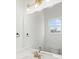 Clean bathroom with a large mirror, vanity, and window at 5860 Pittmon Ln, Kannapolis, NC 28081