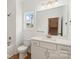 Modern bathroom boasting white cabinetry, quartz countertop, gold hardware, and a shower-tub combination at 5860 Pittmon Ln, Kannapolis, NC 28081