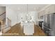 Bright, open-concept kitchen features an island with seating and stainless steel appliances at 5860 Pittmon Ln, Kannapolis, NC 28081