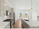 Well-lit kitchen boasting modern appliances, a central island, and plenty of counter space at 5860 Pittmon Ln, Kannapolis, NC 28081