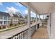 Charming porch overlooking a street of colorful homes at 5860 Pittmon Ln, Kannapolis, NC 28081