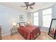 Spacious bedroom with a comfortable bed, ceiling fan, and ample natural light at 1320 Fillmore Ave # 311, Charlotte, NC 28203