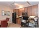 Modern kitchen with dark wood cabinets and granite countertops at 1320 Fillmore Ave # 311, Charlotte, NC 28203