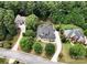 Aerial view of a beautiful home nestled among lush trees, showcasing the home's setting and curb appeal at 7582 Cottonwood Dr # 39, Denver, NC 28037