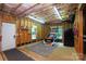 Unfinished basement with wood framing, lighting, and door to the exterior pool area at 7582 Cottonwood Dr # 39, Denver, NC 28037