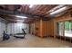 Unfinished basement space with open ceiling, exercise equipment and access to the pool at 7582 Cottonwood Dr # 39, Denver, NC 28037