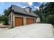 Two-story home with a large driveway and multiple garage doors at 7582 Cottonwood Dr # 39, Denver, NC 28037