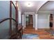 Inviting foyer with hardwood floors, arched doorways, and a view into the living area at 7582 Cottonwood Dr # 39, Denver, NC 28037