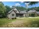 Beautiful home boasts manicured front yard and covered porch sitting area at 7582 Cottonwood Dr # 39, Denver, NC 28037