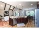 Open-concept kitchen with a large island, stainless steel appliances, and an adjacent dining area at 7582 Cottonwood Dr # 39, Denver, NC 28037