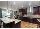 Gourmet kitchen featuring granite countertops, stainless steel appliances, and custom cabinetry at 7582 Cottonwood Dr # 39, Denver, NC 28037