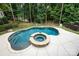 Aerial view of a backyard pool and hot tub surrounded by mature trees at 7582 Cottonwood Dr # 39, Denver, NC 28037
