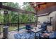 Outdoor porch with comfortable seating overlooking the pool and backyard at 7582 Cottonwood Dr # 39, Denver, NC 28037