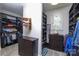 Organized walk-in closet with shelves, hanging rods, and a dresser for storage at 7582 Cottonwood Dr # 39, Denver, NC 28037