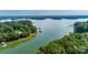 Panoramic aerial view showcasing the lake and surrounding lush greenery at 2518 Wellesbourne Ln, Sherrills Ford, NC 28673