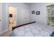 Inviting bedroom with an ensuite bathroom, closet, and window creating a comfortable private space at 2518 Wellesbourne Ln, Sherrills Ford, NC 28673