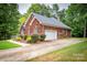 Well-maintained brick home with a spacious driveway and landscaped yard at 2518 Wellesbourne Ln, Sherrills Ford, NC 28673