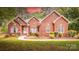 Charming brick home with well-manicured landscaping and a welcoming entrance at 2518 Wellesbourne Ln, Sherrills Ford, NC 28673