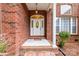 Charming brick home featuring a bright front entrance with brick columns at 2518 Wellesbourne Ln, Sherrills Ford, NC 28673