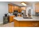 Bright kitchen features granite counters, stainless steel appliances, and light wood cabinetry at 2518 Wellesbourne Ln, Sherrills Ford, NC 28673