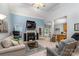 Open living room with fireplace, high ceilings, and seamless access to the kitchen at 2518 Wellesbourne Ln, Sherrills Ford, NC 28673