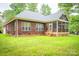 Brick home featuring a screened in porch and a well maintained lawn at 2518 Wellesbourne Ln, Sherrills Ford, NC 28673