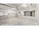 Spacious unfinished basement with concrete floor and stairs at 5830 Pittmon Ln, Kannapolis, NC 28081