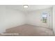 Bedroom featuring neutral carpet and a glass panel back door at 5830 Pittmon Ln, Kannapolis, NC 28081