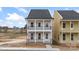 Charming two-story home featuring double balconies, white pillars, black railings, and a welcoming front entrance at 5830 Pittmon Ln, Kannapolis, NC 28081