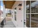 Inviting front porch detail showcasing the lantern, front door with glass panes and exterior wall siding and trim at 5830 Pittmon Ln, Kannapolis, NC 28081