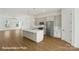 Bright, open kitchen features a large island, stainless appliances, and modern fixtures at 5830 Pittmon Ln, Kannapolis, NC 28081