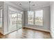 Breakfast nook features hardwood floors and sliding glass doors at 106 N Dunlavin Way # 4, Mooresville, NC 28115