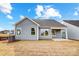 Gray house exterior with a covered patio and grassy backyard at 106 N Dunlavin Way # 4, Mooresville, NC 28115