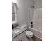 Bathroom with tub and shower combo, granite countertop, and modern fixtures at 9609 Stokes Ferry Rd, Gold Hill, NC 28071