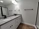 Bathroom with double vanity and granite countertop featuring black hardware and trim at 9609 Stokes Ferry Rd, Gold Hill, NC 28071