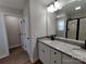 Bathroom features a double vanity with granite countertop and a shower with black trim at 9609 Stokes Ferry Rd, Gold Hill, NC 28071
