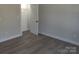 Bedroom with wood-look flooring and closet at 9609 Stokes Ferry Rd, Gold Hill, NC 28071