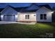 Charming single-story home with a two-car garage, manicured lawn, and modern white siding at 9609 Stokes Ferry Rd, Gold Hill, NC 28071