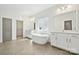 Expansive bathroom featuring dual sinks, soaking tub, and a walk-in closet at 121 Clawton Loop, Mooresville, NC 28115
