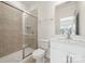 Well-lit bathroom featuring a shower with glass doors and a white vanity with a sink and mirror at 121 Clawton Loop, Mooresville, NC 28115