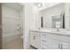 Bright bathroom features dual sinks, a large mirror, and a shower/tub combo at 121 Clawton Loop, Mooresville, NC 28115