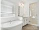 Bright bathroom with a soaking tub, vanity with mirror, and a glass enclosed shower at 121 Clawton Loop, Mooresville, NC 28115