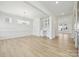 Formal dining room featuring elegant wainscoting, large windows, and a stylish chandelier at 121 Clawton Loop, Mooresville, NC 28115