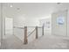 Bright loft space features carpeted floors and a window providing natural light and views at 121 Clawton Loop, Mooresville, NC 28115