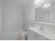 A clean, all-white bathroom featuring a tub/shower combination and a vanity with a sink at 3338 Passmore Rd, Rock Hill, SC 29730