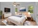 Staged bedroom showcases a bed with a white comforter, side tables, lamps and a white dresser at 3338 Passmore Rd, Rock Hill, SC 29730