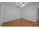 An empty bedroom with neutral walls, wood-look flooring, and a ceiling fan, ready for customization at 3338 Passmore Rd, Rock Hill, SC 29730