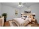 A nicely staged bedroom featuring natural light, a large bed, side tables and artwork at 3338 Passmore Rd, Rock Hill, SC 29730